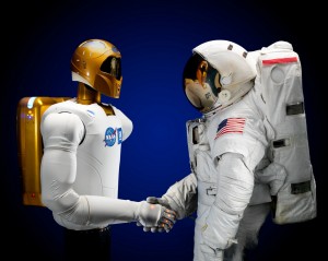 Robonaut shakes hands with an astronaut